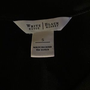 Solid black. 3/4 sleeves w/sweet ruffle on ends and the bottom